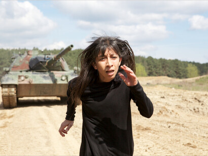 Regina José Galindo, "La sombra", 2017
we cannot escape the horros
it chases us
it's our shadow.

A Loepard, a German tank, pursues me in a circle without a beginning or end. 
photo: Michael Nast, commissioned and produced by Documenta 14, Kassel, Germany