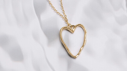 A golden heart-shaped necklace