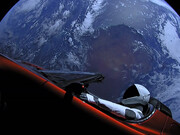 An astronaut riding a Tesla Roadster in space, the Earth serving as background
