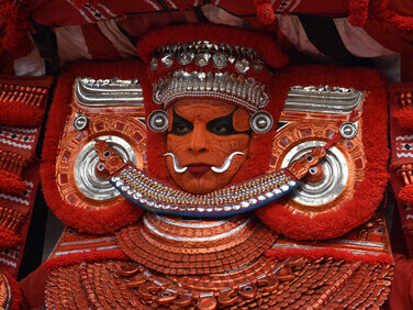 In Kannur, Kerala, Theyyam is a traditional Hindu dance performed in Malabar's temples and sacred groves. With more than 400 variations, it serves as a means for devotees to receive divine blessings
