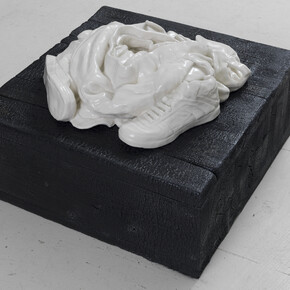 Reza Aramesh, Action 145: Friday April 25, 2003 at 07:55, 2015, Hand sculpted porcelain on charred wood plinth, 6 x 25 x 22 in. Photo by Brian Buckley