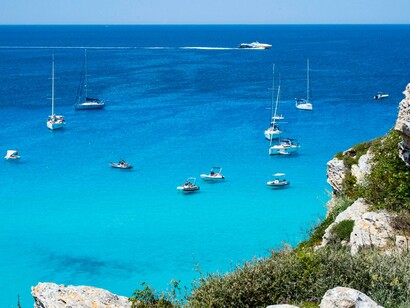 A stunning coastal view of Sicily, featuring the vibrant blue waters and the tranquil Italian seaside
