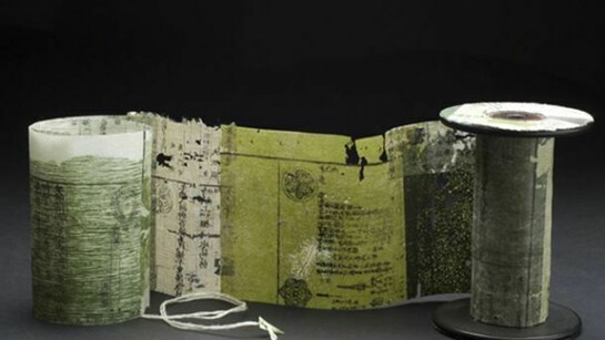 Yuko Kimura, Moss Spool Book no.3, 2012, etching on antique book pages from Japan, linen thread, wooden spool, 4 1/4 x 3 x 43 inches