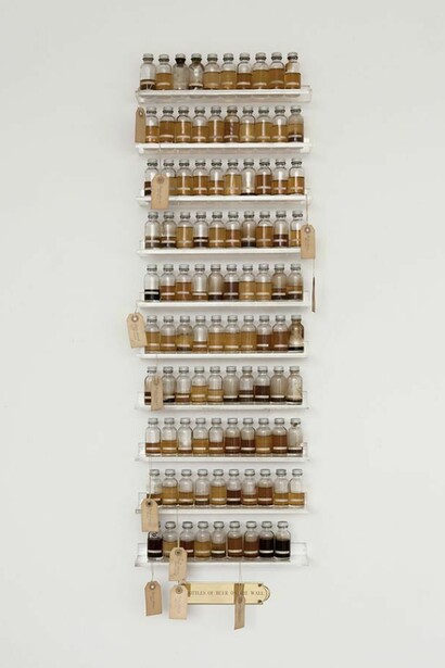 Candy Jernigan, 99 Bottles of Beer on the Wall, c. 1988-89, Beer, glass vials, packing tags and Plexiglas shelves, 48 x 14 x 3 1/2 inches (121.9 x 35.6 x 8.9 cm)