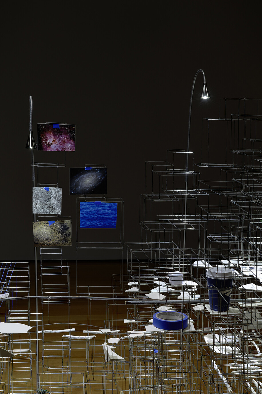 Sarah Sze, Still Life with Desk, 2013-2015, Mixed media, photographs printed on paper, clay, chairs, stainless steel, wood, lamps, heater, plants, rocks, pantone swatches. Dimensions variable. Work made in collaboration with the Fabric Workshop and Museum, Philadelphia, Courtesy the Artist and Victoria Miro, London © Sarah Sze