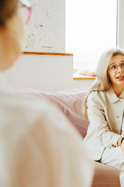Woman sharing grievance with therapist