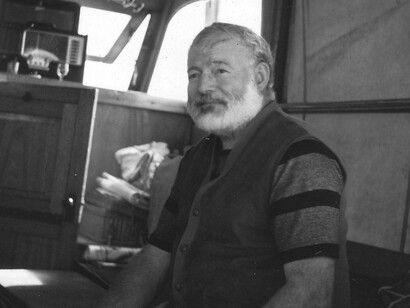 Ernest Hemingway in the cabin of his boat "Pilar", off the coast of Cuba