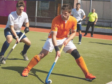 Field hockey athletes in the midst of a high-stakes tournament game