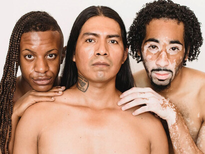 Men of various racial backgrounds standing against a blank white backdrop