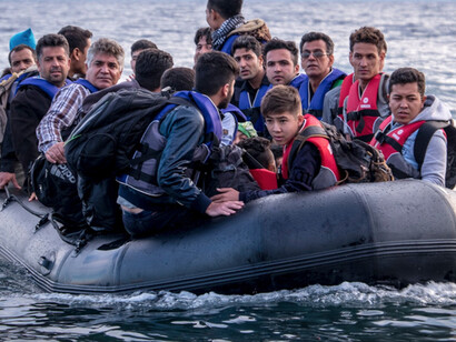 Migrants arriving in Greece by boat