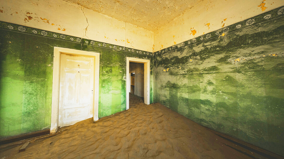 Doorways through time in an abandoned house in Kolmanskop, Namibia, photographed by Francesco Ungaro