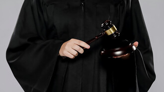 A female judge with gavel, symbolizing authority and justice