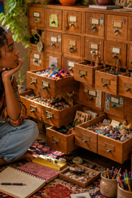 A collection of drawers overflowing with keepsakes, reflecting the idea of creating tiny rooms for important things