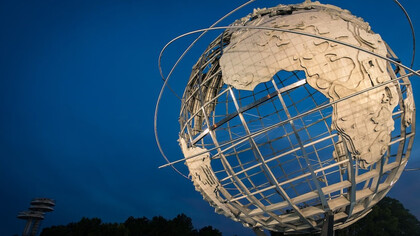 Captivating low-angle photograph of a metallic Earth-themed statue, New York, USA
