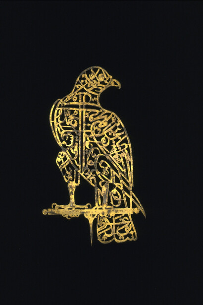 Calligraphic ‘Alam in the Shape of a Falcon Golconda, 17th century, Perforated gilt copper, H. 13¾ in. (34.9 cm), W. 8 in. (20.3 cm), Victoria and Albert Museum, London, Image: © Victoria and Albert Museum