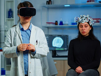 A researcher studying a brain scan on a screen, leveraging AI in healthcare to improve patient outcomes and precision in medical analysis