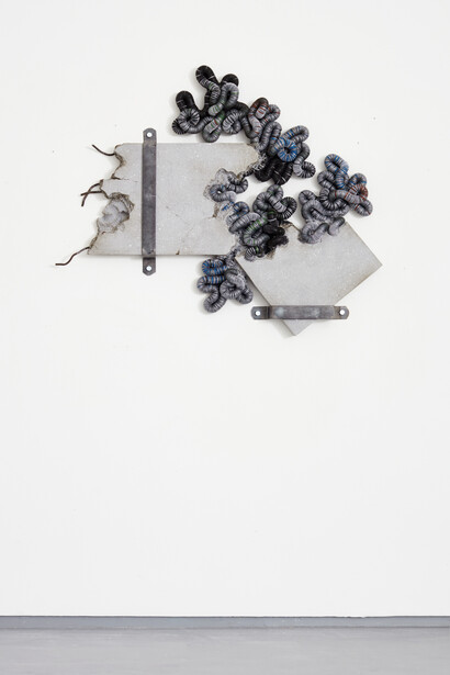 Chris Soal, Holding Out, 2023, discarded beer bottle caps threaded onto electic fencing 
cable, held in polyurethane sealant on board, glass fibre reinforced concrete with used motor car oil and rebar and flat bar, 127x126x12 cm. Courtesy the artist and Piero Atchugarry Gallery