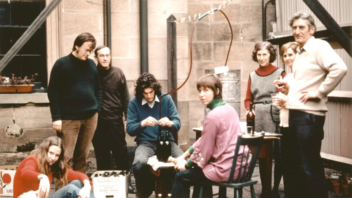 NSW Government Astronomer and Director of Sydney Observatory Harley Wood bottling wine in the Observatory courtyard with family and friends, 1972. Courtesy of Powerhouse