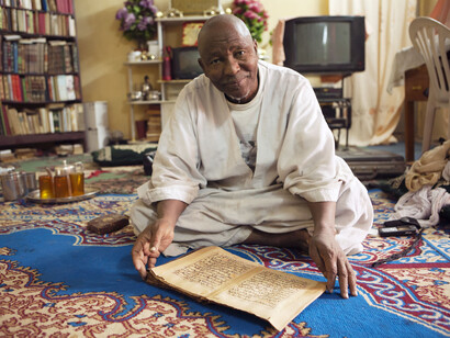Imam, Timbuktu photographed by Alexandra Huddleston, 2007, on display in West Africa: Word, Symbol, Song. (c) Alexandra Huddleston