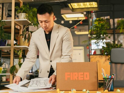 A laid-off professional quietly clearing their desk, symbolising the broader transformation unfolding across global industries