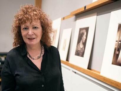 Nan Goldin alongside her artwork in the Metropolitan Museum of Art in New York City
