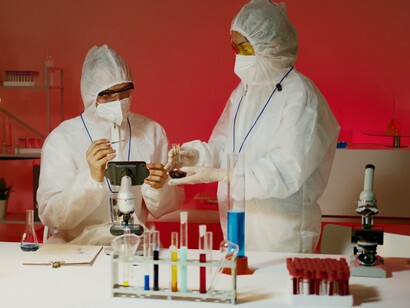Scientists handling laboratory samples with precision, representing the blending of advanced research and AI-driven drug discovery