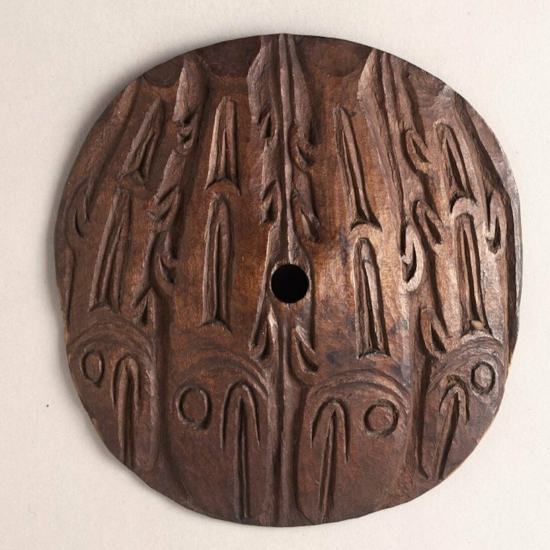 Coast Salish spindle whorl made of wood, collected from Nanaimo, Vancouver Island, mid-19th century. © The Trustees of the British Museum  