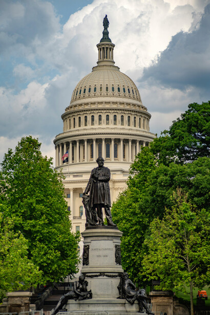 Located in Washington, D.C., the United States Capitol Building stands as a symbol of American democracy, accompanied by a striking statue on its grounds