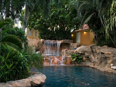 This serene pool area embodies the luxurious charm of the Hotel Kurá Hulanda Spa and Casino, a boutique resort situated in Willemstad's Otrobanda district