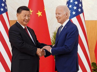 President of China Xi Jinping holding hands with President of US Joe Biden