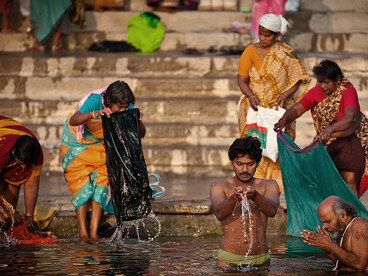 Amid extreme temperatures, people in India turn to water to find relief from the heat