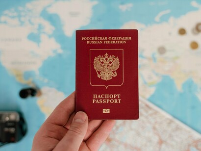 A passport against a global map, reflecting the international flow of workers and ideas