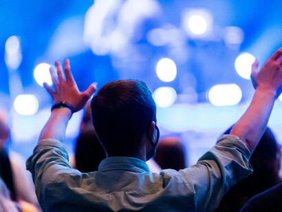 Audience watching a live stage performance