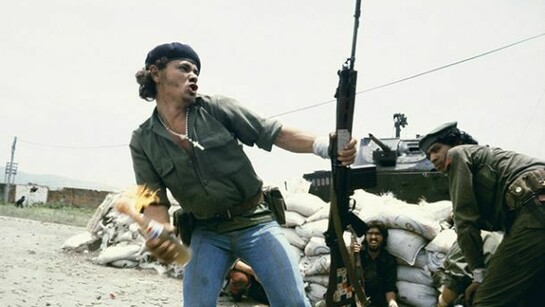 Susan Meiselas, Sandinistas at the walls of the Estelí National Guard headquarters: 'Molotov Man', Estelí, Nicaragua, July 16th, 1979, 1979, Chromogenic print, 16 x 20 inches (40.6 x 50.8 cm)