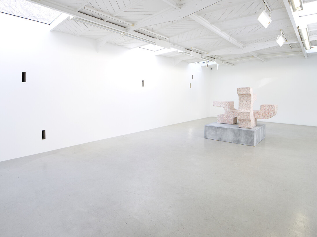 Valentin Carron - Un mur cinq trous, 2014, 5 arrow loopholes, concrete, painting, wood, Variable dimensions - Ravage with granite (after André Tommasini), 2014, Polystyrene and resin, 147 x 162 x 130 cm, View of the exhibition « L’autoroute du soleil à minuit », kamel mennour (47, rue Saint-André des Arts), Paris, 2015 © Valentin Carron, Photo: Fabrice Seixas, Courtesy the artist and kamel mennour, Paris