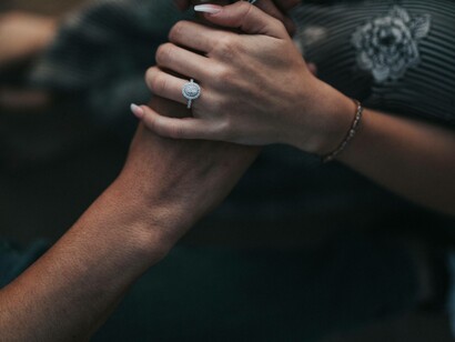 Woman holds a mans hand