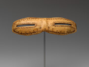 Snow goggles, dating from circa 800–1200, carved from walrus ivory and measuring 1 1/8 × 5 inches (2.9 × 12.7 cm), are part of the American Wing collection at the Metropolitan Museum of Art, USA