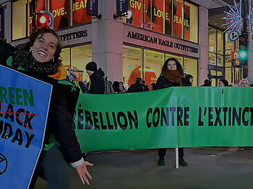 Extinction Rebellion protest in Montreal, Canada in 2019 targeting stores and corporations harming the planet with pollution