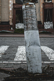 An undetonated missile embbeded into the pavement