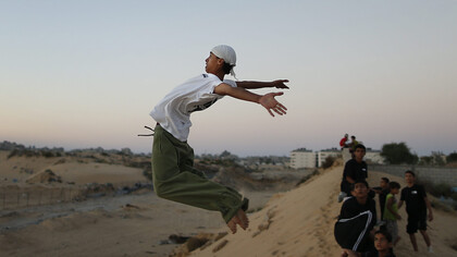 Palestinian boy practices parkour in Khan Younis, southern Gaza 