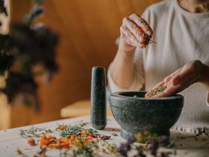 As herbs are crushed, the process highlights the need to reclaim and value South Asian wellness traditions