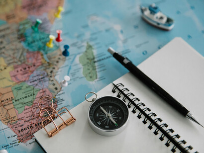 A map, a compass and a pen, ready to start all over again