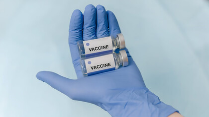Doctor's hands holding vaccine