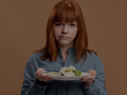 A woman with an eating disorder making an effort to choose healthier options