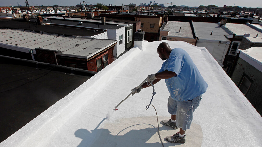 Painting a New York City rooftop with reflective paint fights heat