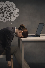 A moment of quiet collapse: burnout made visible in the space between effort and rest