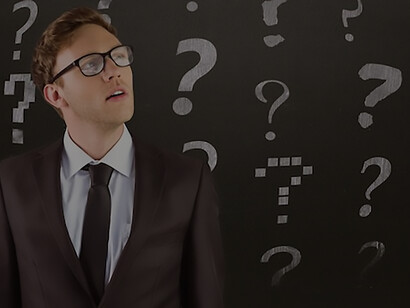 A reflective man, his contemplation illustrated by a backdrop of questioning symbols