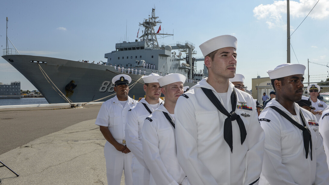Sailors from the USS Iwo Jima (LHD 7) attend a ceremony commemorating the arrival of three ships from China's People's Liberation Army-Navy [PLA(N)] at Naval Station Mayport as part of a routine goodwill port visit