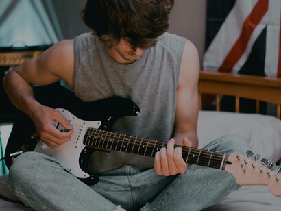 A young man concentrating and relaxing as creativity flows