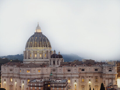 Side view of St Peter's Basilica, clouds gathering on the background